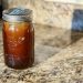 A Ball jar of cold brew sits on a granite counter, awaiting the 24-hours of steeping to come.